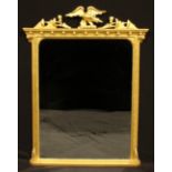 A Regency style giltwood chimney glass, rectangular mirror plate, the frame crested by an eagle,