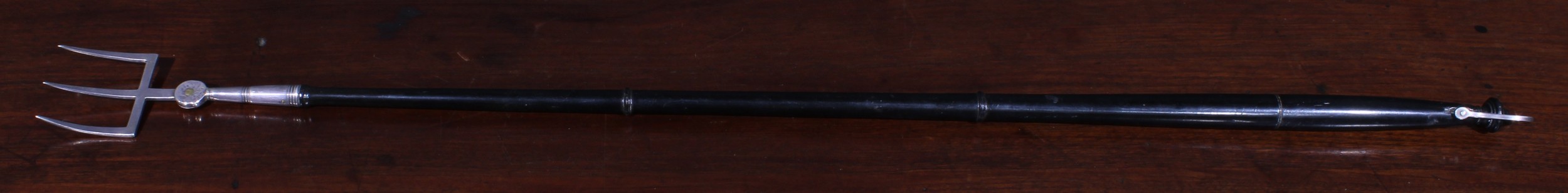 A George III silver toasting fork, the three-prong terminal adjustable on a pivot, turned ebonised - Image 2 of 3