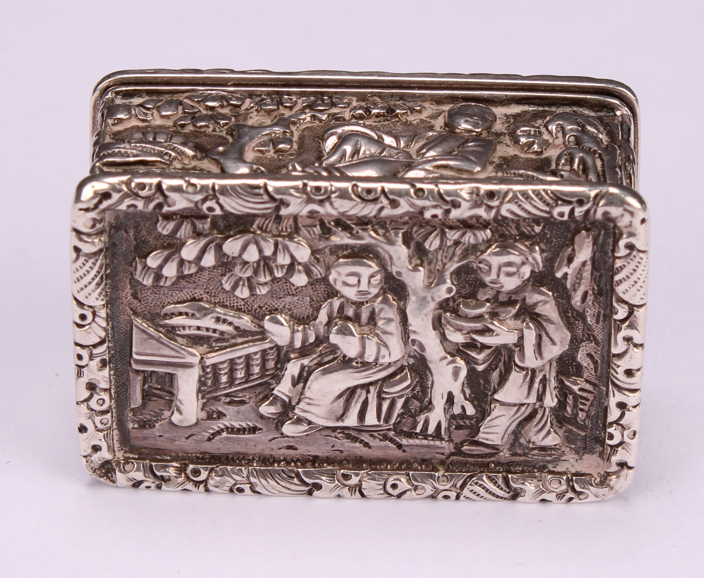 A Chinese silver rectangular vinaigrette, in relief with young boys in landscapes and riding a - Image 5 of 5