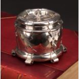 Liberty & Co - an Arts and Crafts silver tea caddy, applied with scrolling brackets and cut-card