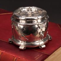 Liberty & Co - an Arts and Crafts silver tea caddy, applied with scrolling brackets and cut-card