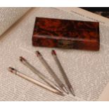 A set of four sterling silver propelling pencils/bridge scoring markers, rectangular finials applied