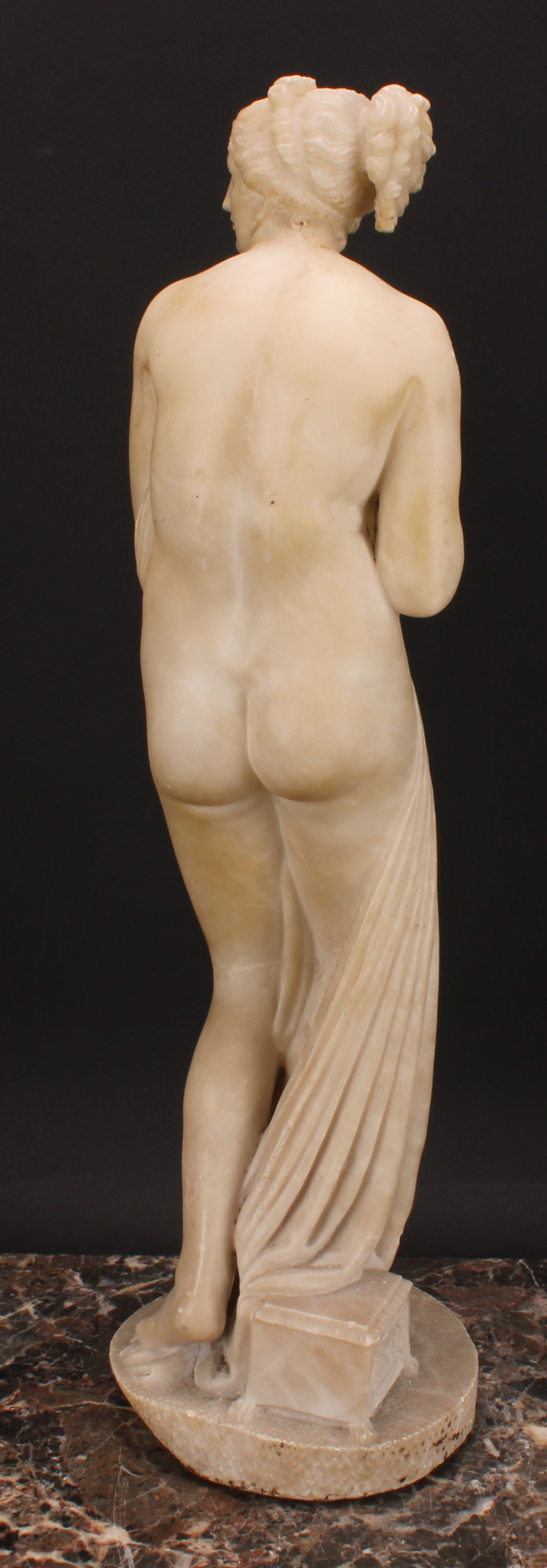 A 19th century alabaster figure, Venus Bathing, after the Antique, circular base, 53cm high - Image 4 of 4