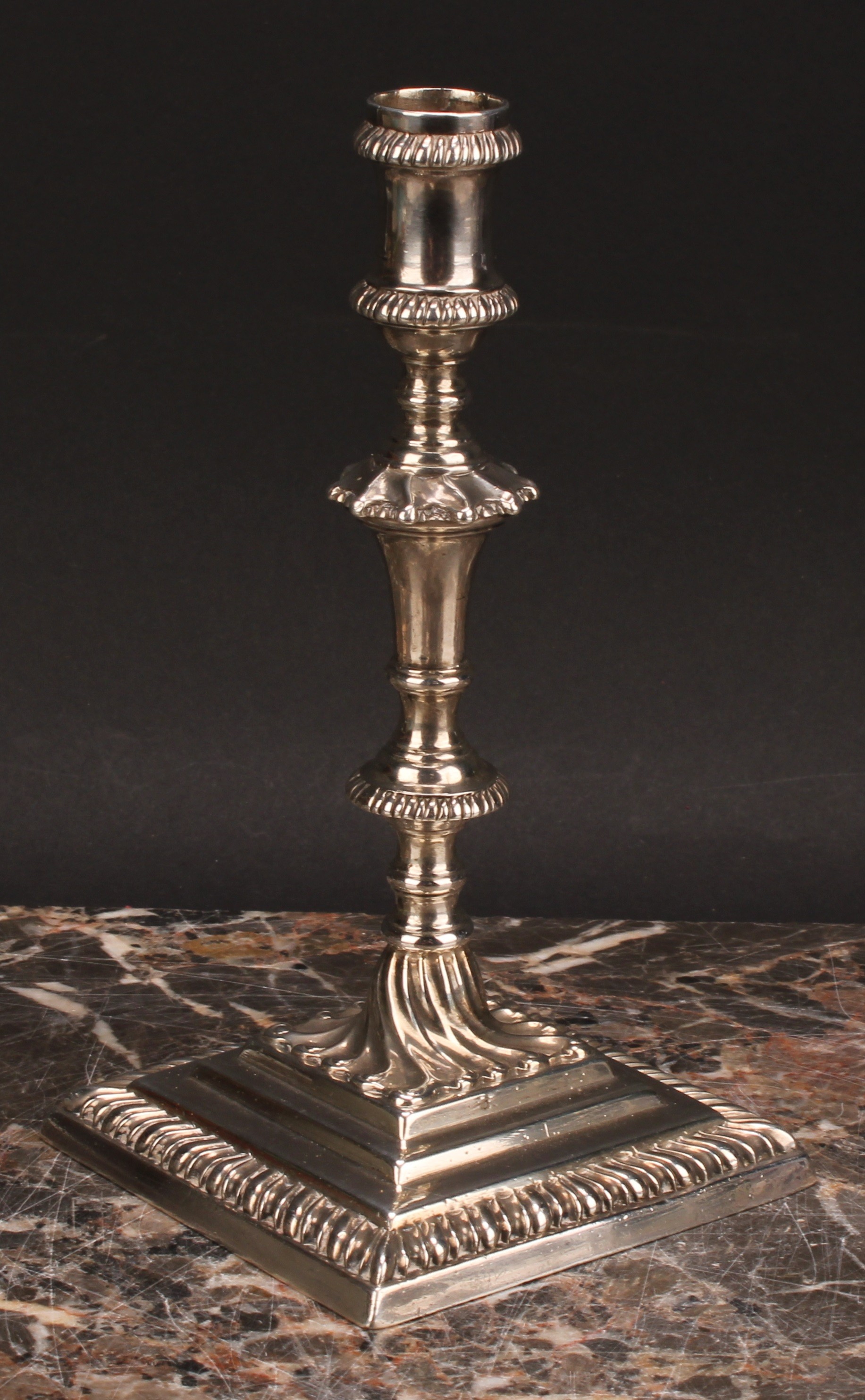 An early George III cast silver taperstick, knopped pillar, stepped square base with gadrooned - Image 3 of 4