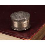 A George III silver circular pill box or bonbonniere, push-fitting cover, bright-cut engraved with