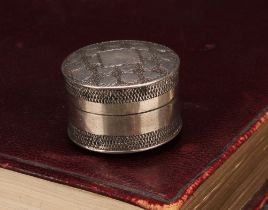 A George III silver circular pill box or bonbonniere, push-fitting cover, bright-cut engraved with