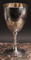 A Victorian silver pedestal goblet, bright-cut engraved with flowers, stiff leaves and strapwork,