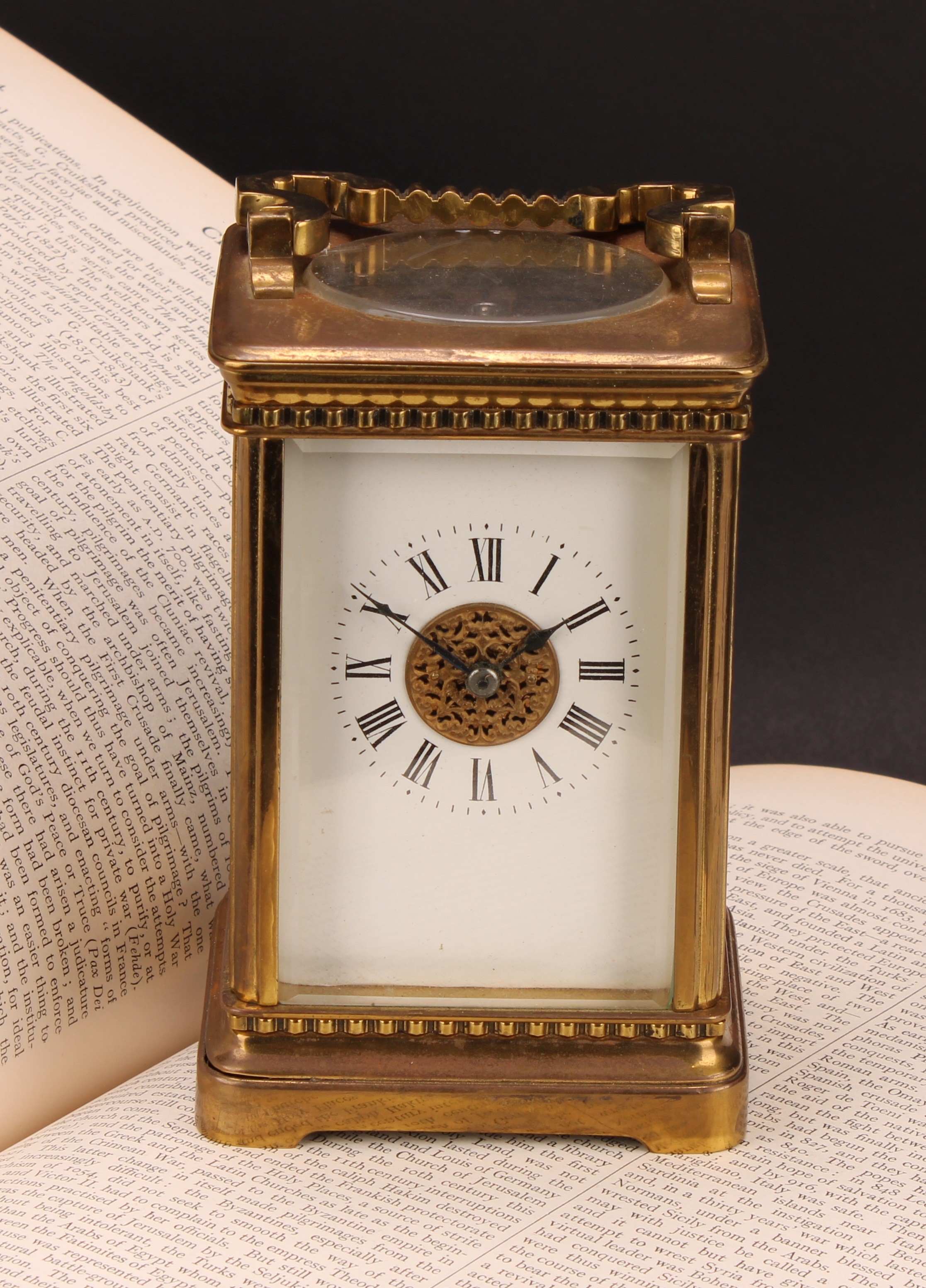 An early 20th century lacquered brass carriage clock, 6cm rectangular enamel dial inscribed with