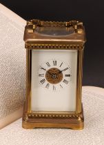 An early 20th century lacquered brass carriage clock, 6cm rectangular enamel dial inscribed with