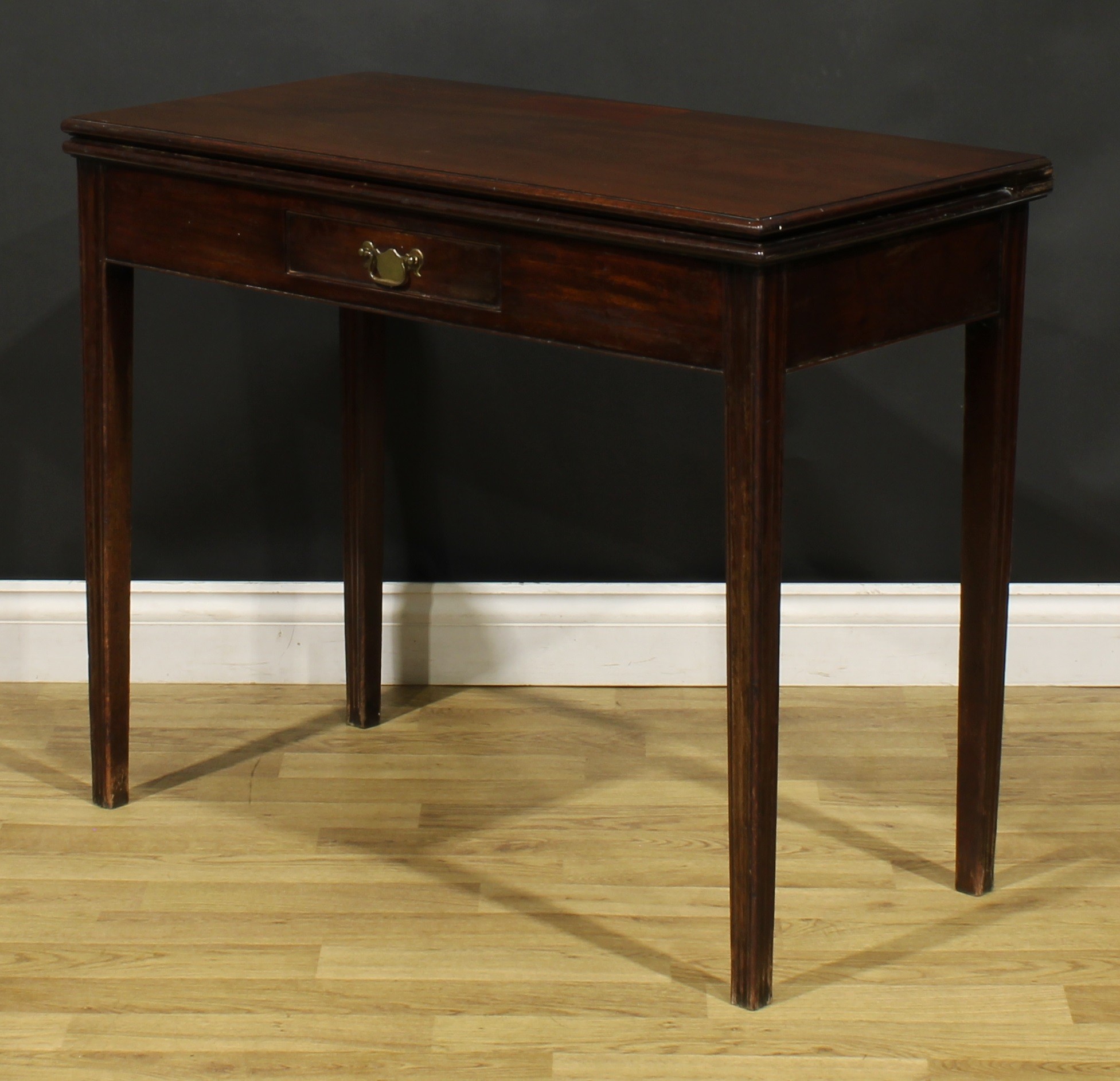 A George III mahogany card table, hinged top with moulded edge enclosing a baize lined playing - Image 6 of 7