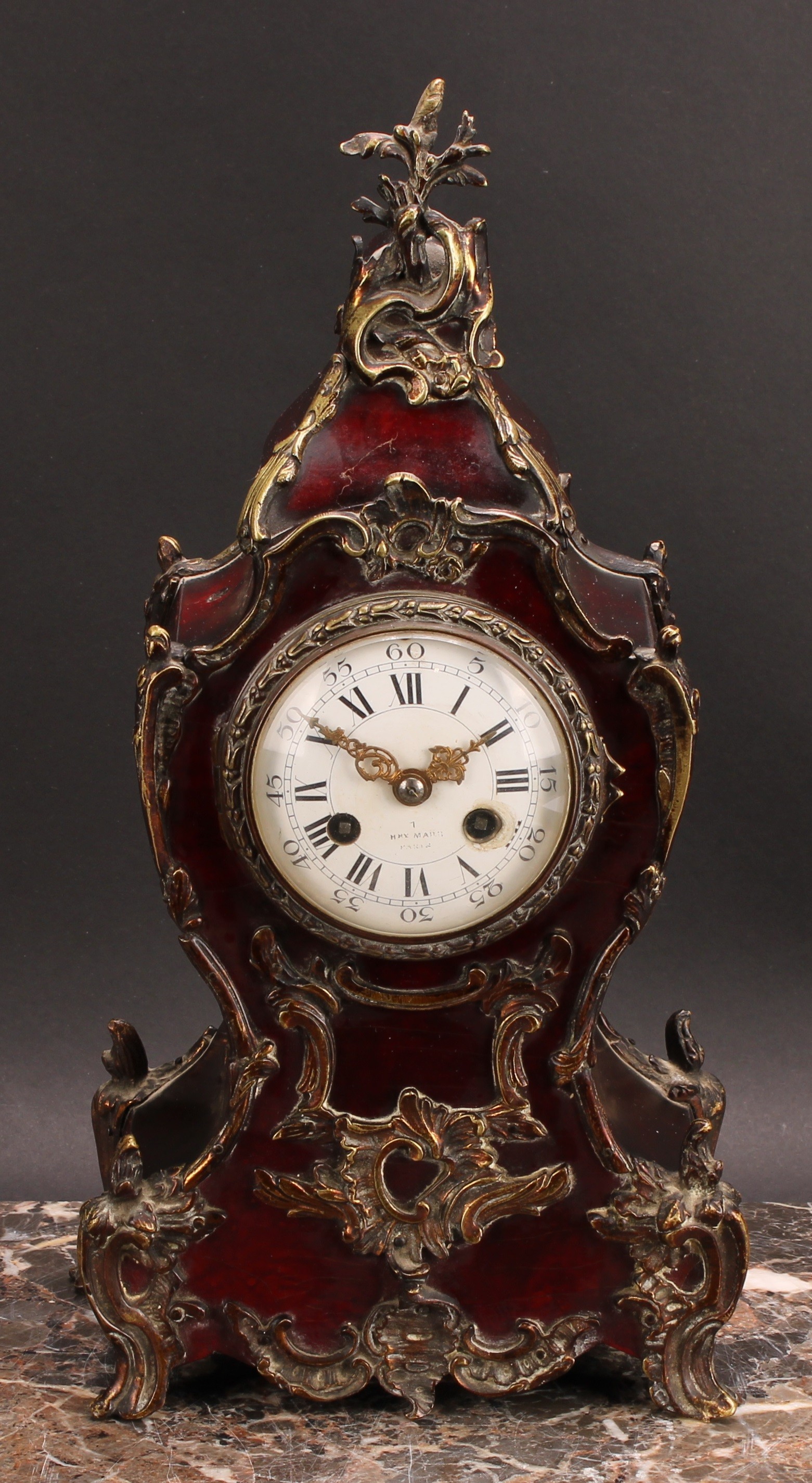 A Louis XV Revival gilt metal mounted simulated tortoiseshell mantel clock, 8cm circular enamel dial