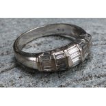 A diamond and 18ct white gold ring, with five bands of baguette cut stones, ring size M, 5.3g gross