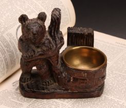 A Black Forest carved bear matchbox and vesta holder, brass liner, 11cm high