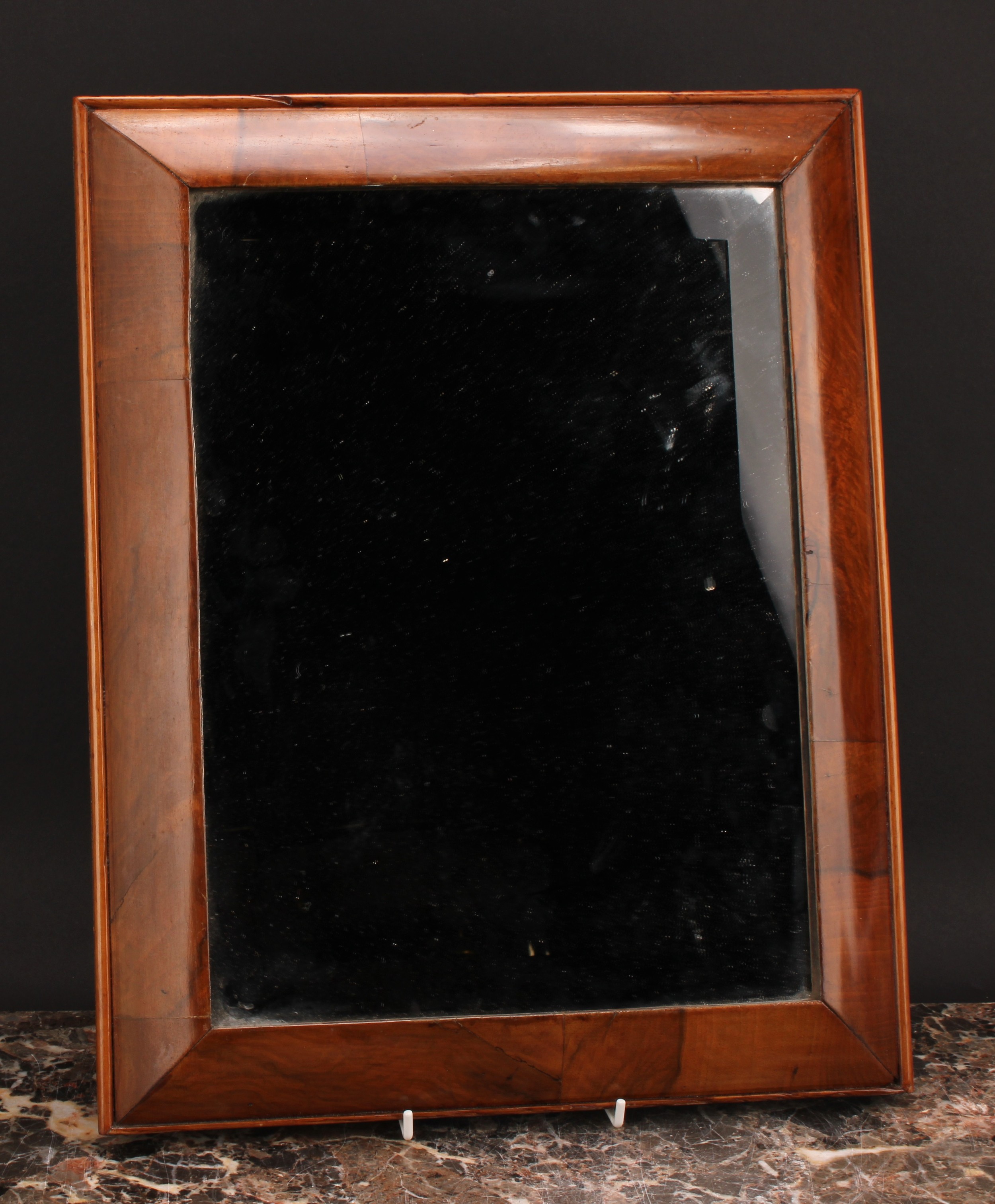 A 19th century walnut cushion mirror, bevelled plate, 43cm x 34cm