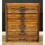 An early to mid-20th century oak primary printer’s or draughtsman’s plan chest, now fitted for the