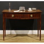 A Regency mahogany bowfront bedroom side table, oversailing top with moulded edge above a long