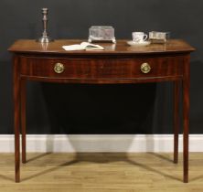 A Regency mahogany bowfront bedroom side table, oversailing top with moulded edge above a long