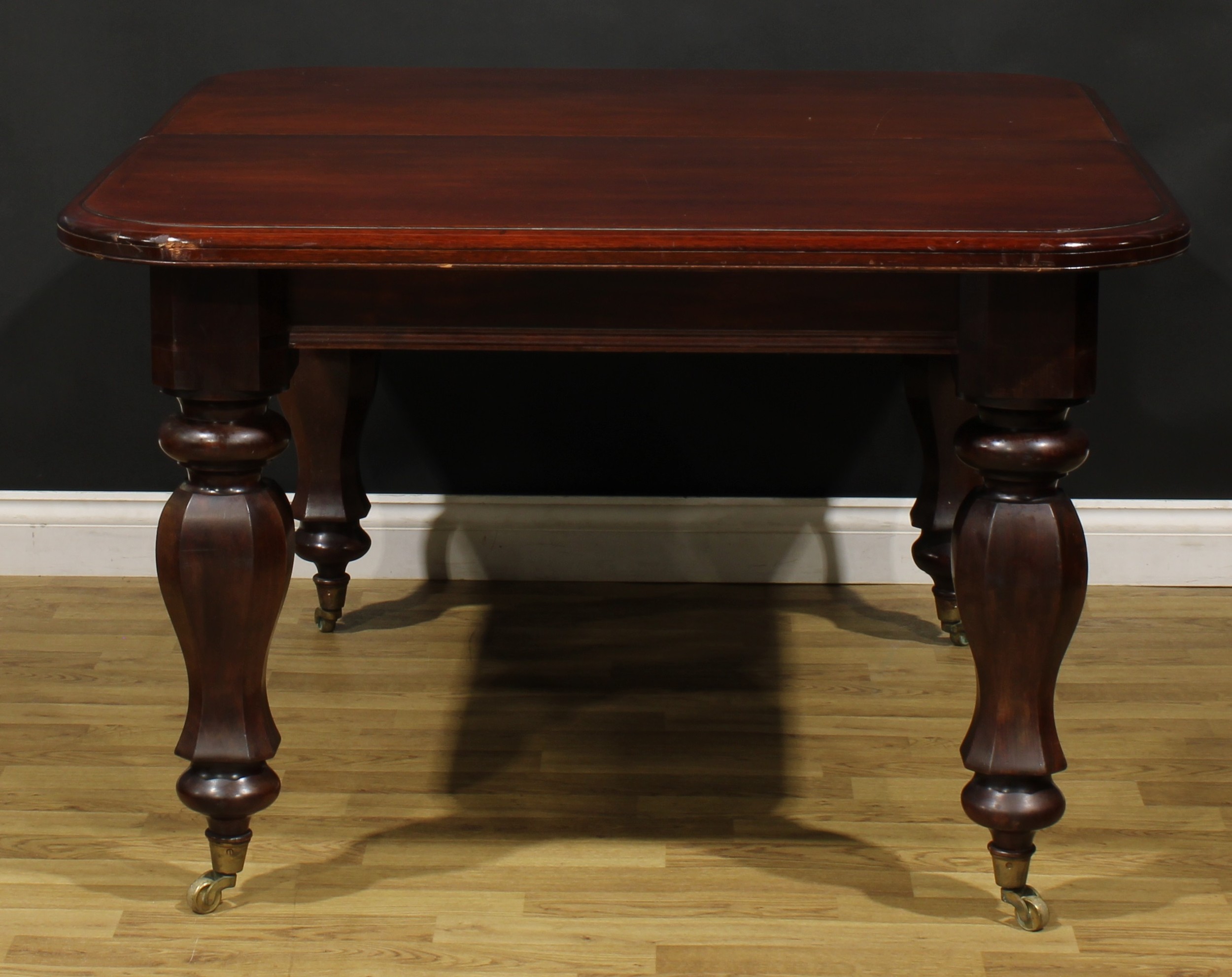An early Victorian mahogany extending dining table, rounded rectangular top with moulded edge and - Image 3 of 3