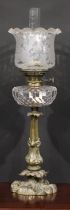 An Art Nouveau period brass table oil lamp, Hink's Duplex No.2 burner, facetted clear glass font,