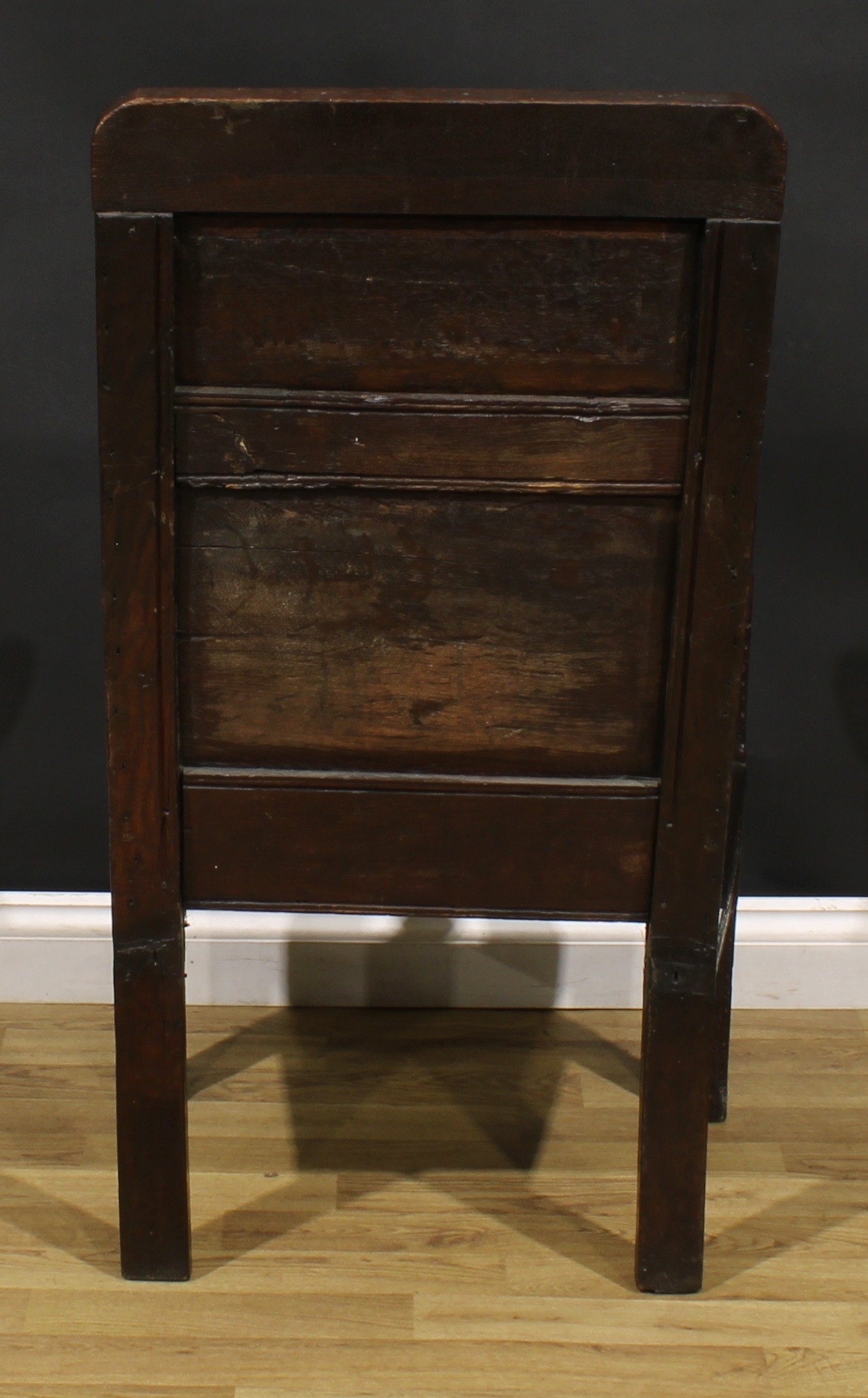 A 17th century oak wainscot armchair, rectangular panel back carved with lozenges and leafy scrolls, - Image 4 of 4