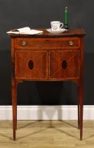 A Sheraton Revival satinwood crossbanded mahogany bowfront bedroom or chamber cabinet, oversailing