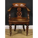 A Victorian oak desk chair, by Thomas Simpson & Sons, Halifax, Yorkshire (fl.1876-1954), badged,