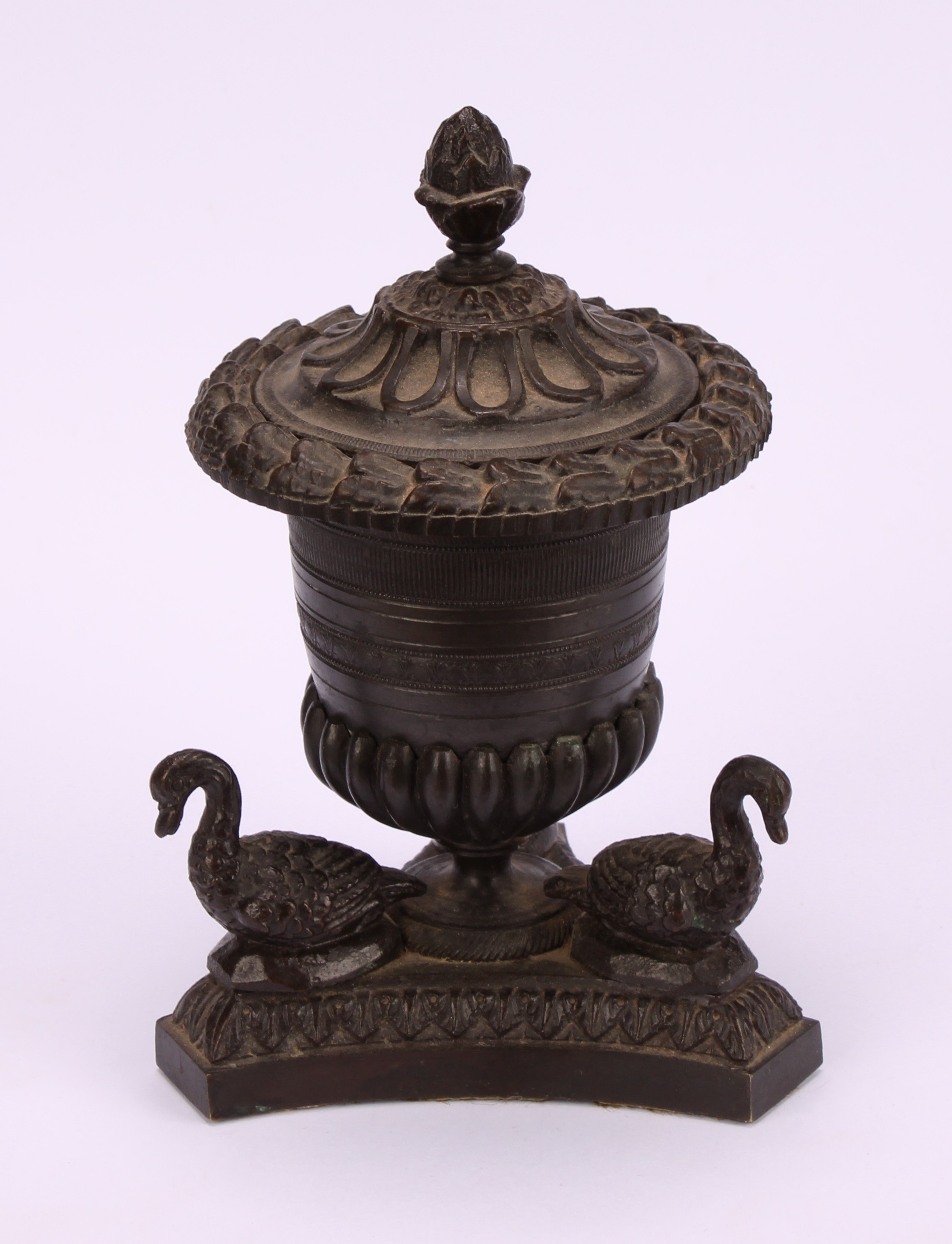 A Regency dark patinated bronze half-fluted campana inkwell, the incurve canted triform base applied - Image 2 of 4