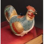 A Japanese satsuma teapot, as a cockerel, painted in polychrome and picked out in gilt, 18cm long,