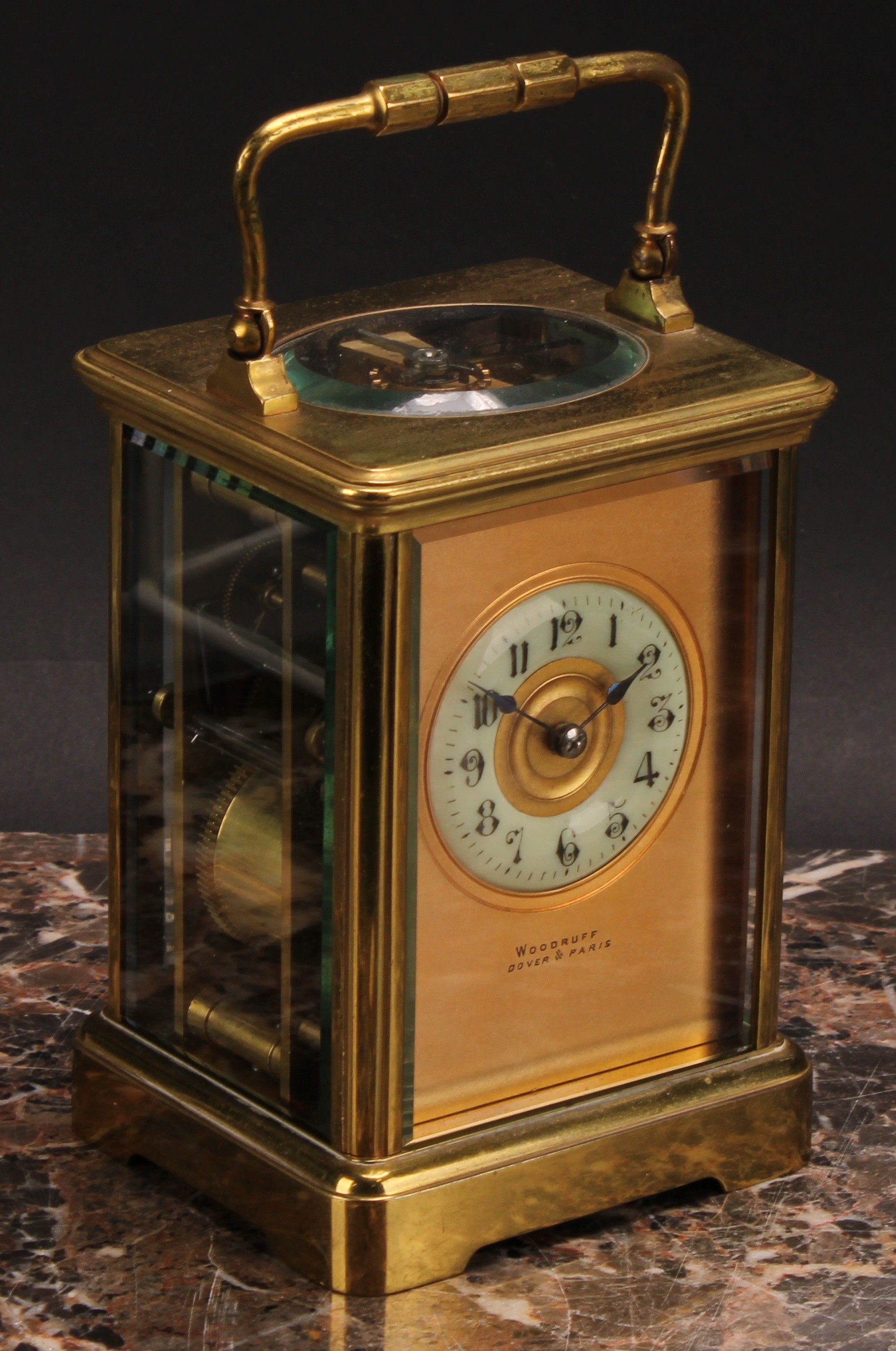 A late 19th century lacquered brass carriage clock, the gilt dial inscribed Woodruff, Dover & Paris,
