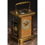 A late 19th century lacquered brass carriage clock, the gilt dial inscribed Woodruff, Dover & Paris,