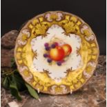 A Royal Worcester shaped circular plate, painted by J. Freeman, signed, with ripening fruit within