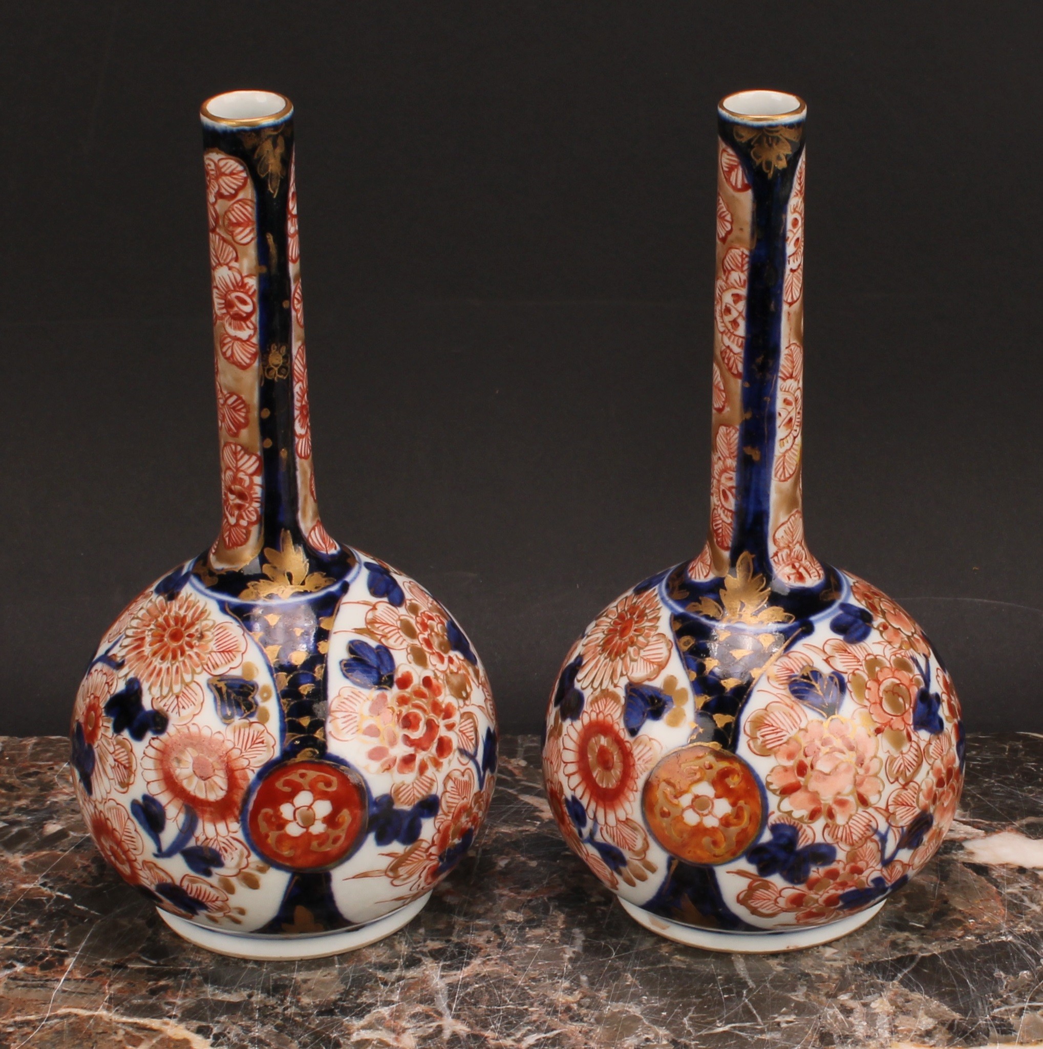 A pair of Japanese porcelain bottle vases, decorated in the Imari palette with peonies and - Image 2 of 8