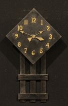 An Arts & Crafts ebonised wall clock, 46cm dial applied with brass Arabic numerals, twin winding