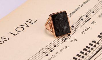 A Victorian black onyx glass mourning ring, rectangular cameo panel bust portrait of a figure with