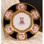 A Chamberlains Worcester armorial plate, centred with the Arms of Hullock impaling Martin, above the