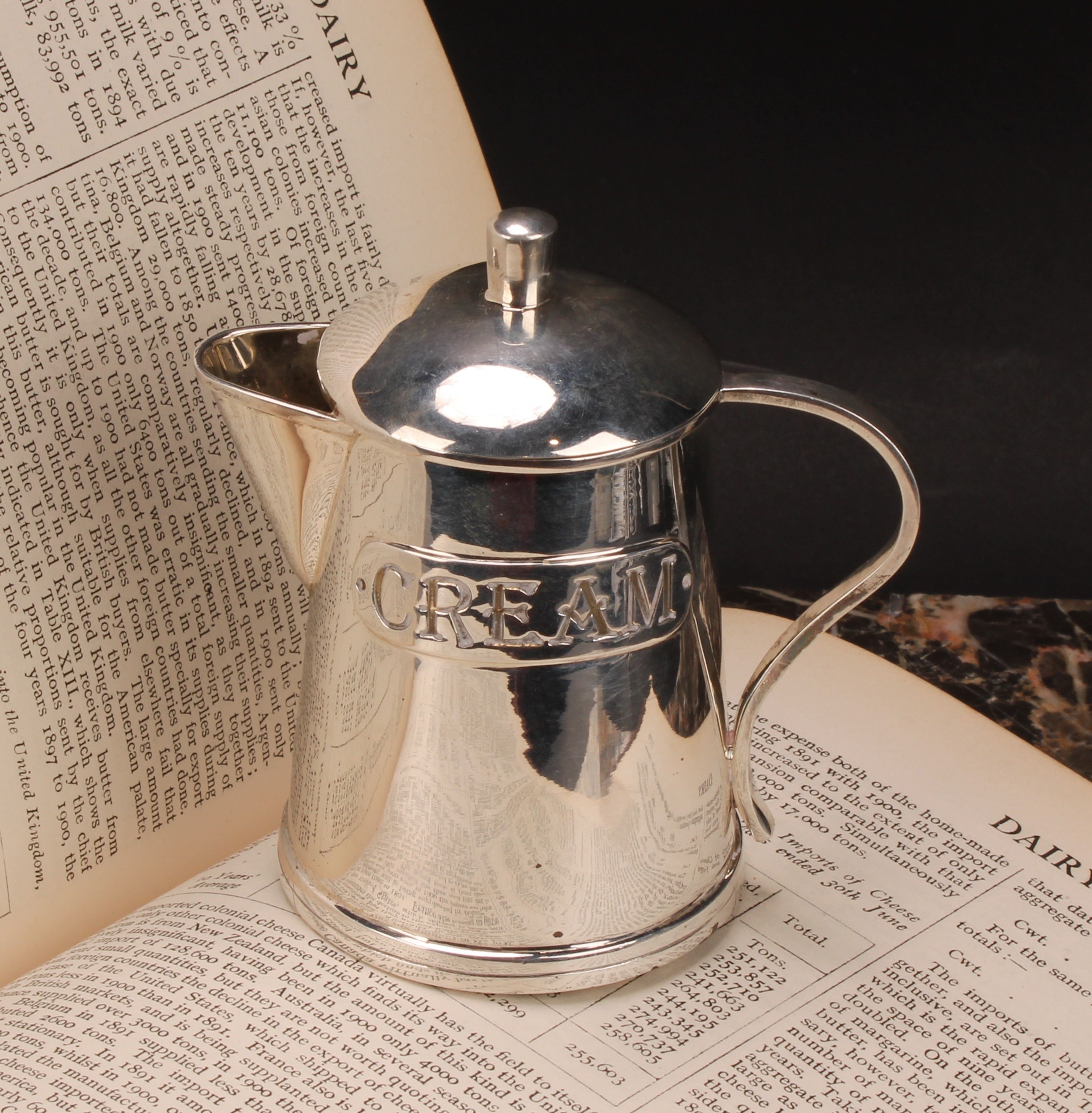 An unusual silver novelty covered cream jug, as a dairy can, inscribed Cream, 9.5cm high, import