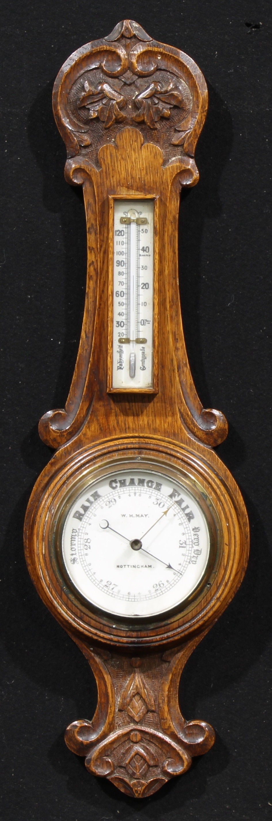 A late Victorian/Edwardian oak wheel barometer, 11.5cm circular register inscribed W.H. MAY,