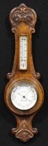 A late Victorian/Edwardian oak wheel barometer, 11.5cm circular register inscribed W.H. MAY,