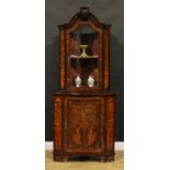 A 19th century Dutch marquetry floor standing corner display cabinet, arched cresting above a glazed