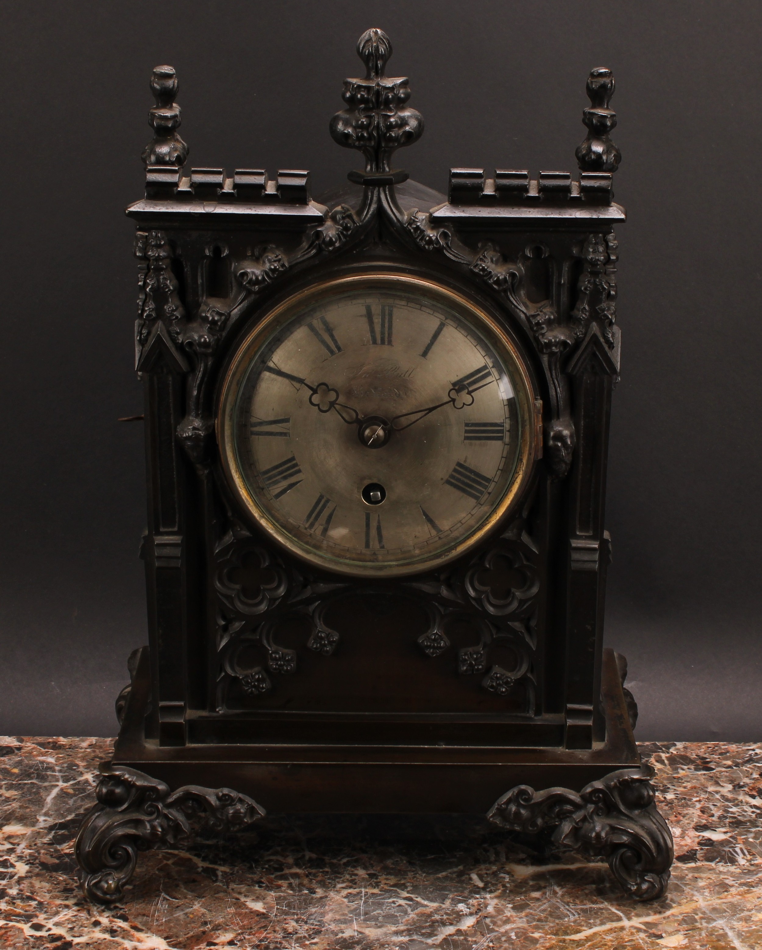 A Victorian Gothic Revival cast bronzed metal double-fusee bracket clock, 12.5cm circular silvered