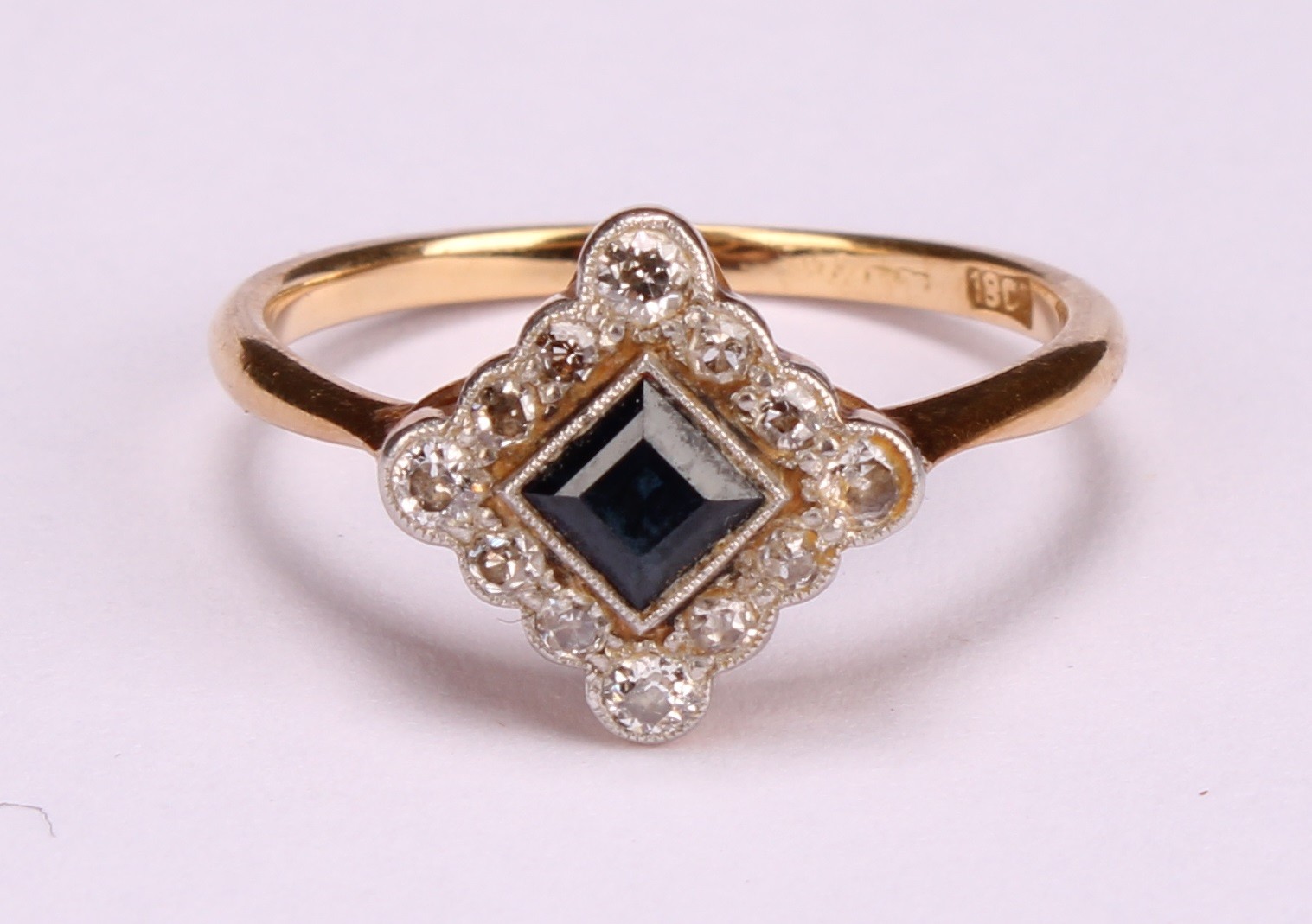 A diamond and sapphire square set cluster ring, the central cushion cut stone within a border of - Image 5 of 8