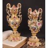A pair of 19th century French porcelain vases, in the Rococo Revival taste, painted and encrusted
