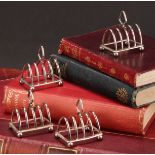 A set of four George V silver miniature five bar toast racks, 5cm long, Adie Brothers Ltd,