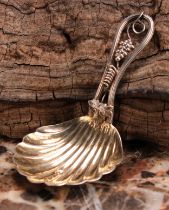 A Victorian silver caddy spoon, shell bowl, the stem with fruiting vine, 7.5cm long, George Unite,