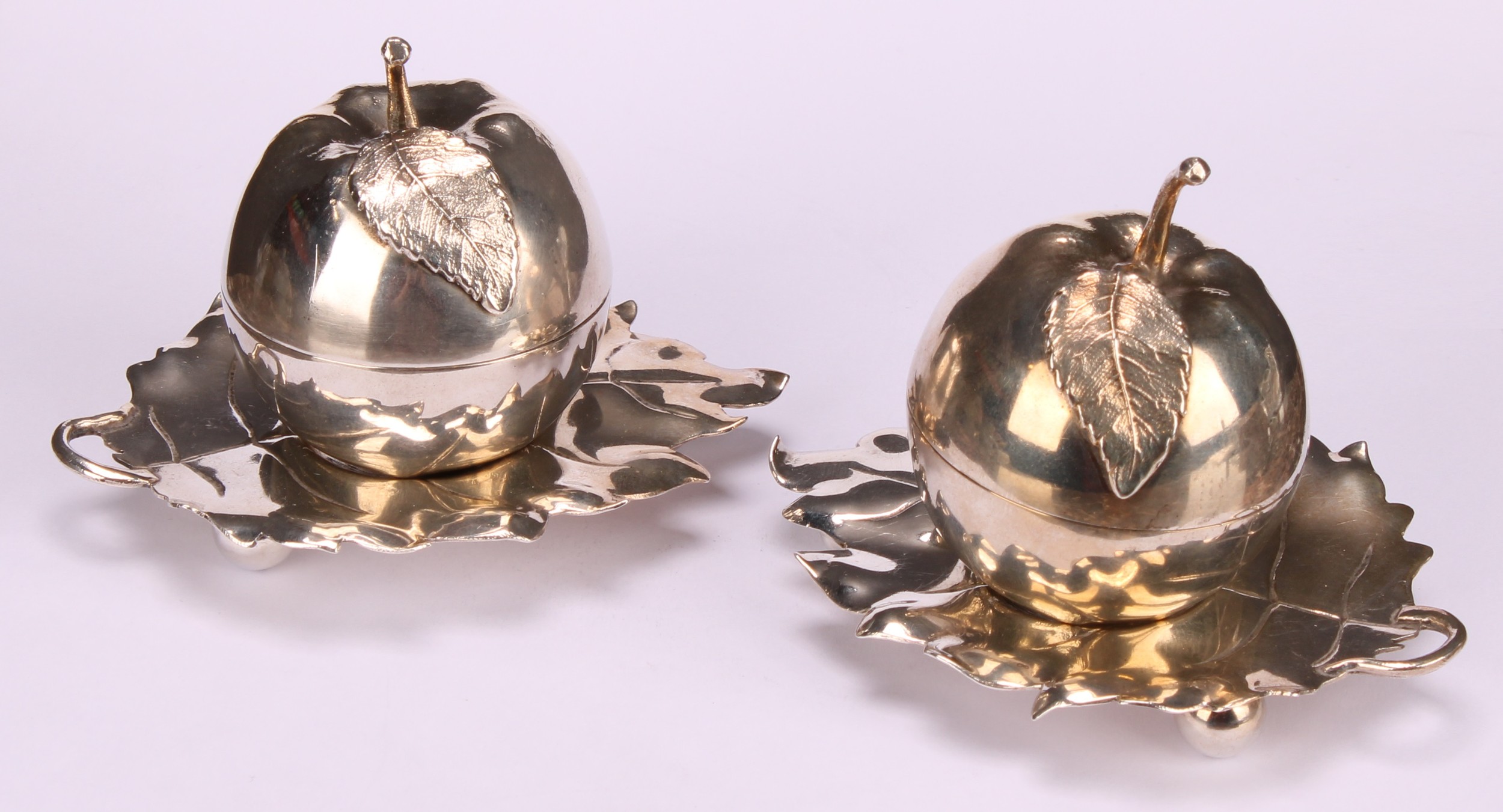 A pair of Elizabeth II silver novelty condiments and stands, modelled as apples, the cast leaf - Image 2 of 16