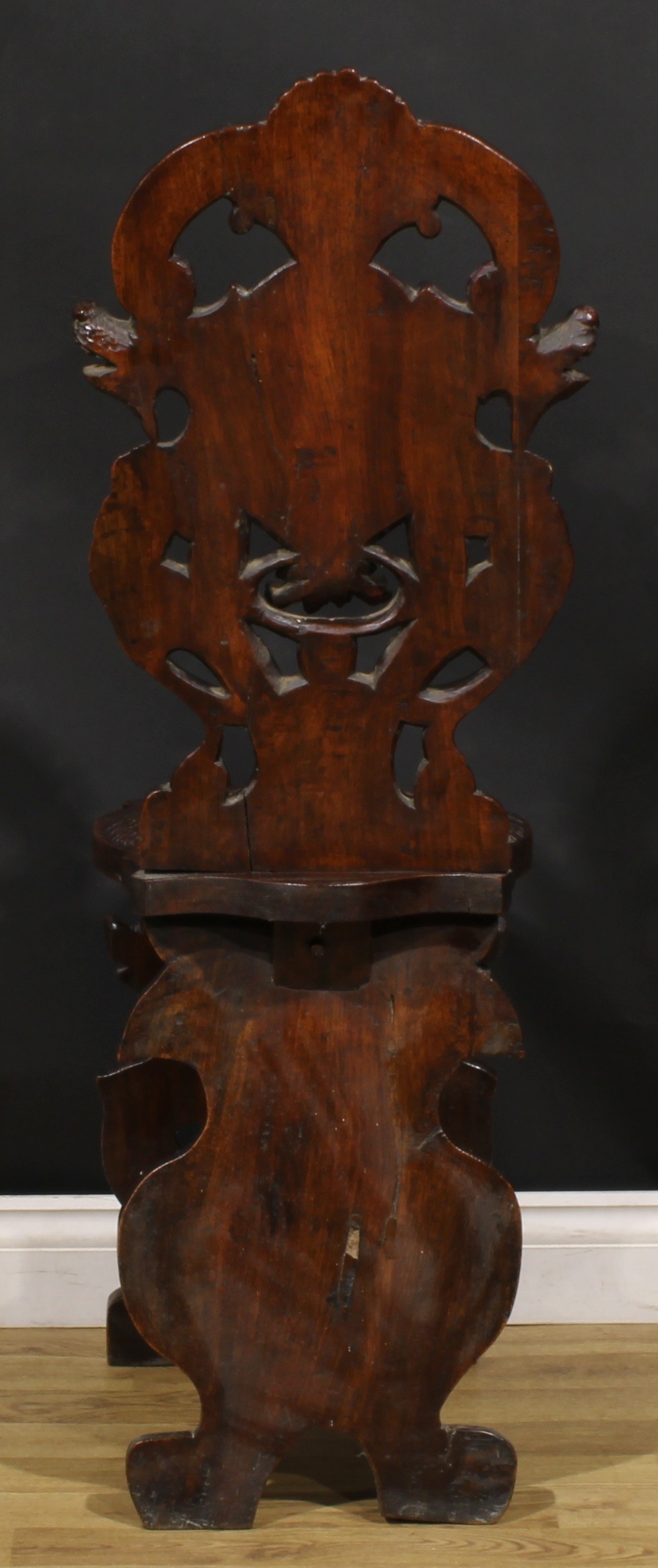 A pair of 19th century Italian walnut sgabelli or hall chairs, carved throughout in the - Image 5 of 9