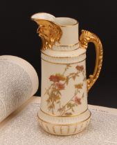 A Royal Worcester jug, decorated in the Aesthetic manner with flowers and foliage in muted tones,