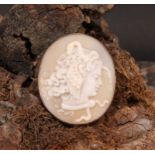 A Victorian carved cameo brooch, Medusa with serpent and winged hair, indistinctly4.5cm x 3.8cm,