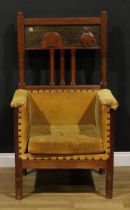 A large and unusual Arts & Crafts entrance hall chair, rectangular cresting rail carved with a