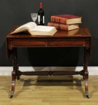 A Regency mahogany sofa table, possibly Irish, rounded rectangular top with fall leaves above a pair